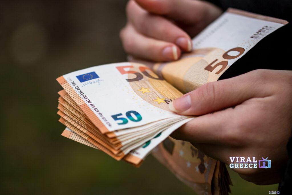 closeup female hands counting euro banknotes world money inflation economy concept Viral Greece