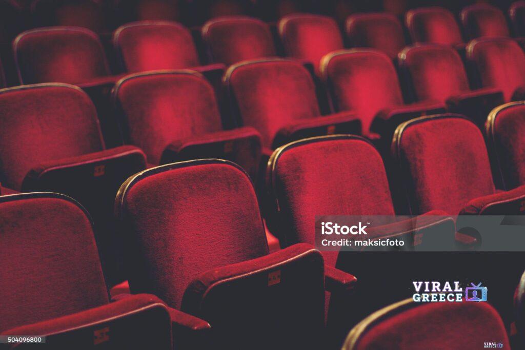 Empty comfortable red seats with numbers in cinema Viral Greece